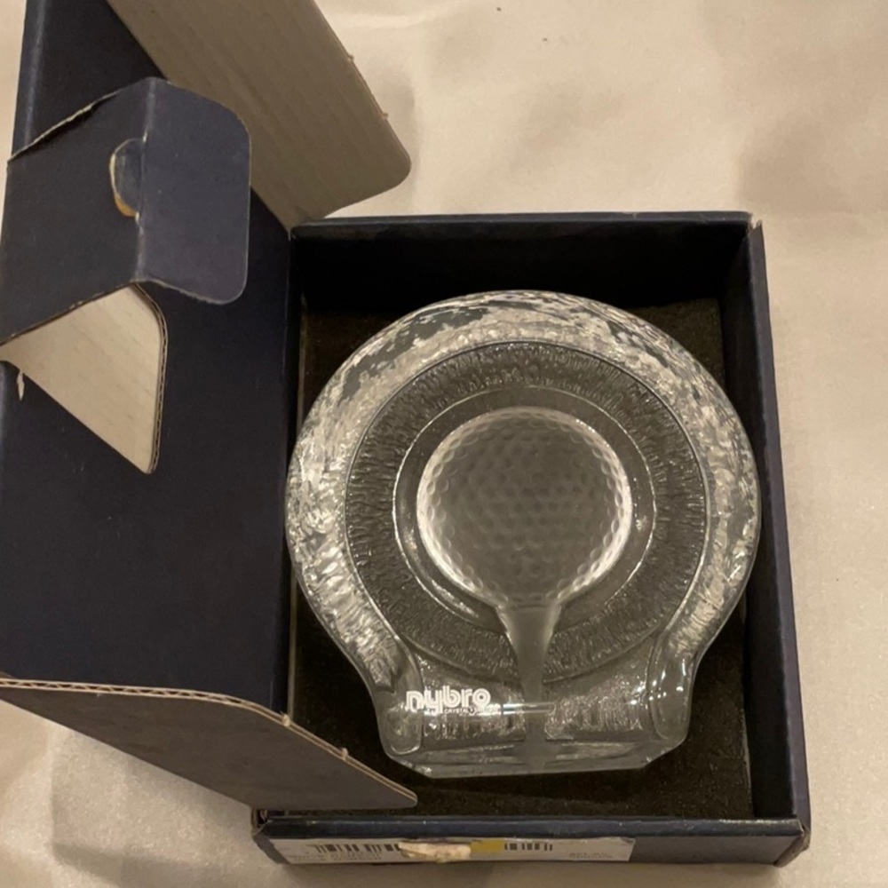NYBRO Sweden golf ball on tee glass piece.